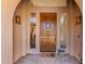 Inviting front entryway with beautiful wood door, sidelights, and covered porch at 2011 W Calle De Las Estrella --, Phoenix, AZ 85085