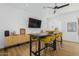 Game room featuring a table with seating for eight with a large-screen television at 2011 W Calle De Las Estrella --, Phoenix, AZ 85085