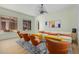 Open concept living room with ample seating, large windows, and light-colored walls at 2011 W Calle De Las Estrella --, Phoenix, AZ 85085