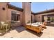 Outdoor patio with brick flooring, stylish seating, fireplace and direct access to inside living spaces at 2011 W Calle De Las Estrella --, Phoenix, AZ 85085