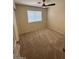 Bedroom with carpet flooring, a ceiling fan, and a window at 20275 N 81St Ln, Peoria, AZ 85382