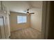 Carpeted bedroom with ceiling fan and window at 20275 N 81St Ln, Peoria, AZ 85382