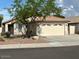 Charming single-story home with a well-maintained front yard and a two-car garage at 20275 N 81St Ln, Peoria, AZ 85382