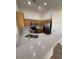 Bright kitchen featuring quartz countertops, wood cabinets, and stainless steel appliances at 20275 N 81St Ln, Peoria, AZ 85382