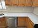 Bright kitchen featuring quartz countertops, wood cabinets, and stainless steel appliances at 20275 N 81St Ln, Peoria, AZ 85382