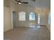 Spacious living room with carpet and archways at 20275 N 81St Ln, Peoria, AZ 85382