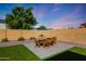 The backyard shows a dining table set up with an impressive view of the sky at 20834 W Prospector Way, Buckeye, AZ 85396