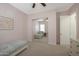 Comfortable bedroom with mirrored closet, ceiling fan, and soft carpet for a relaxing atmosphere at 20834 W Prospector Way, Buckeye, AZ 85396
