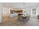Spacious dining area open to kitchen features wood floors and pendant lighting at 20834 W Prospector Way, Buckeye, AZ 85396