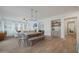 Open-concept dining area boasts a large table, neutral colors, and modern lighting fixtures at 20834 W Prospector Way, Buckeye, AZ 85396