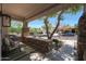 Welcoming front porch with stone accents, neutral stucco, and comfortable seating area at 20834 W Prospector Way, Buckeye, AZ 85396