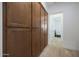 Hallway with wooden built-in cabinets and access to another room at 20834 W Prospector Way, Buckeye, AZ 85396