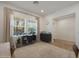Bright office with a large window, neutral decor and a view of the neighborhood at 20834 W Prospector Way, Buckeye, AZ 85396