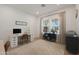 Bright home office featuring a modern desk setup and natural light from the window at 20834 W Prospector Way, Buckeye, AZ 85396