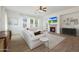 Bright living room featuring a fireplace, media, and comfortable sectional sofa at 20834 W Prospector Way, Buckeye, AZ 85396