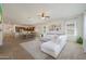 Spacious living room featuring an open floor plan to the kitchen and dining area at 20834 W Prospector Way, Buckeye, AZ 85396