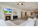 Living room featuring a fireplace, media, and an open floor plan at 20834 W Prospector Way, Buckeye, AZ 85396