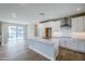 Bright, open kitchen with an island, modern appliances, and a sliding glass door at 2121 W Sonoran Desert Dr # 43, Phoenix, AZ 85085