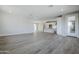 Open-concept living room featuring light wood floors and an easy flow to the kitchen at 2121 W Sonoran Desert Dr # 43, Phoenix, AZ 85085