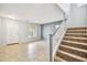 The home's entryway features tile floors, a staircase and a white front door at 2323 W Hunter Ct, Phoenix, AZ 85085