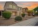 Charming two-story home with beautiful landscaping and a warm, inviting facade at 2323 W Hunter Ct, Phoenix, AZ 85085
