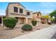 Charming two-story home with beautiful landscaping and a warm, inviting facade at 2323 W Hunter Ct, Phoenix, AZ 85085