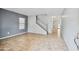 Open-concept living room with tile flooring and plenty of natural light at 2323 W Hunter Ct, Phoenix, AZ 85085