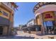 Exterior view of a busy shopping center with a variety of restaurants and retail spaces at 2323 W Hunter Ct, Phoenix, AZ 85085