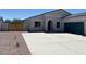 Inviting single-level home featuring a well-manicured front yard and a private gated entrance at 2512 N Pony Ln, Casa Grande, AZ 85122