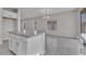 Bright, open kitchen featuring a large island, granite countertops, and stainless steel appliances, with tiled floors at 2512 N Pony Ln, Casa Grande, AZ 85122
