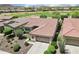 Aerial view of landscaped home in a golf course community with beautiful mountain views at 27320 N 127Th Dr, Peoria, AZ 85383