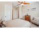 Bedroom featuring neutral decor, large windows, and closet at 27320 N 127Th Dr, Peoria, AZ 85383
