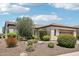 Desert landscaped home featuring a well maintained yard and tile roof at 27320 N 127Th Dr, Peoria, AZ 85383