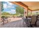 Inviting outdoor patio with comfortable seating and serene golf course views at 27320 N 127Th Dr, Peoria, AZ 85383