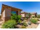 Well-maintained home with desert landscaping, providing a welcoming entrance and low-maintenance appeal at 27537 W Yukon Dr, Buckeye, AZ 85396