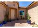 Inviting front entrance with desert landscaping and a charming neutral-toned facade at 27537 W Yukon Dr, Buckeye, AZ 85396