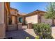 Lovely front entry with gated courtyard and desert landscaping for added privacy and curb appeal at 27537 W Yukon Dr, Buckeye, AZ 85396