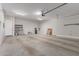Spacious garage with neutral walls and concrete floor at 27537 W Yukon Dr, Buckeye, AZ 85396
