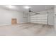 Spacious garage with neutral walls and concrete floor at 27537 W Yukon Dr, Buckeye, AZ 85396