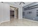 Open concept living room with contemporary shelving and bright lighting at 27537 W Yukon Dr, Buckeye, AZ 85396