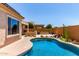 Sparkling pool with tanning deck and desert landscaping, perfect for outdoor entertaining and relaxation at 27537 W Yukon Dr, Buckeye, AZ 85396