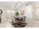 Dining area with neutral walls, tile floors, and a view into another room at 280 W Sheffield Ave, Gilbert, AZ 85233