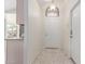 Bright entryway with neutral walls, tile floors, and an arched window above the front door at 280 W Sheffield Ave, Gilbert, AZ 85233