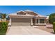 Single-story home featuring a wide driveway, two-car garage and desert landscaping at 280 W Sheffield Ave, Gilbert, AZ 85233