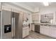 Bright kitchen with stainless steel fridge, sleek countertops, and light wood cabinets at 280 W Sheffield Ave, Gilbert, AZ 85233