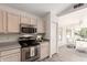 Charming kitchen boasts stainless steel appliances, bright wood cabinets, and a convenient microwave at 280 W Sheffield Ave, Gilbert, AZ 85233