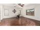 Spacious living room offers hardwood flooring, large windows, and a ceiling fan at 280 W Sheffield Ave, Gilbert, AZ 85233