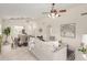 Open-concept living room and dining area filled with neutral decor and modern lighting at 280 W Sheffield Ave, Gilbert, AZ 85233