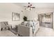 Comfortable living room with neutral walls, tile floors, and a sliding glass door to the patio at 280 W Sheffield Ave, Gilbert, AZ 85233
