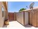Outdoor storage shed situated adjacent to a privacy gate and mature desert landscaping at 280 W Sheffield Ave, Gilbert, AZ 85233